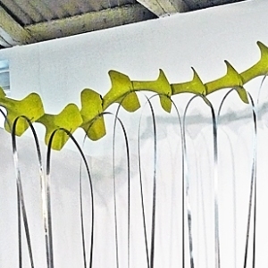 Akirasaurus • Installation, Airplane Parts, Hoist Hooks, Shim Stock, R.A.M.S.E.S Recycled-Assembled-Metal-Surplus-Engineered-Scrap, 108 x 84 x 48-60 inches (274.32 x 213.36 x 121.92 cm) All dimensions slightly variable.