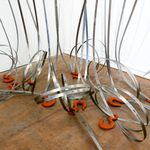Akirasaurus (Detail View From Above) • Installation, Airplane Parts, Hoist Hooks, Shim Stock, R.A.M.S.E.S Recycled-Assembled-Metal-Surplus-Engineered-Scrap, 108 x 84 x 48-60 inches (274.32 x 213.36 x 121.92 cm) All dimensions slightly variable.