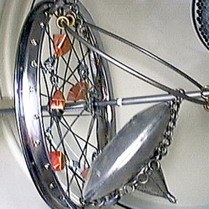 Dryer Roarer in situ • Dryer Installation (For Carole Kim Concept), Spring Rod, Bicycle Wheel, Canteen, Fishing Bells, Exploding Rocks Candy, Scrap Metal, 26.5 x 13 x 13 inches (67.31 x 33.02 x 33.02 cm)