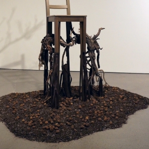 Deception • Detail Lower • 2017 • Mixed Media Black Walnut Branch, Found Chair, Acrylic Paint, Sumac Roots and Faux Roots, Black Walnuts, Potting Soil • 112 inches x 70 inches x 60 inches (285 cm x 178 cm x 122 cm)
