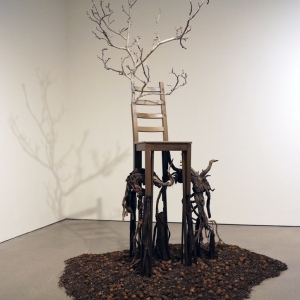 Deception • Full Left View • 2017 • Mixed Media Black Walnut Branch, Found  Chair, Acrylic Paint, Sumac Roots and Faux Roots, Black Walnuts, Potting Soil • 112 inches x 70 inches x 60 inches (285 cm x 178 cm x 122 cm)