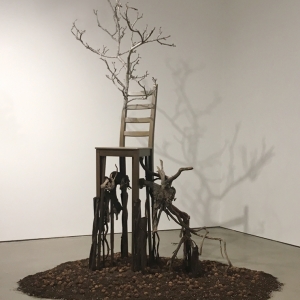 Deception • Full Right View • 2017 • Mixed Media Black Walnut Branch, Found Chair, Acrylic Paint, Sumac Roots and Faux Roots, Black Walnuts, Potting Soil • 112 inches x 70 inches x 60 inches (285 cm x 178 cm x 122 cm