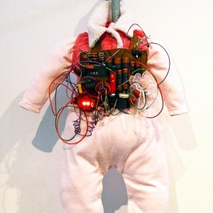 Pinkie, Infant Suicide Bomber Vest Model #2010-2011TL • Mixed Media, R.A.M.S.E.S. Recycled-Assembled-Miscellaneous-Surplus-Engineered-Scrap, 24 X 18 x 12 inches (60.96 x 45.72 x 30.48 cm)